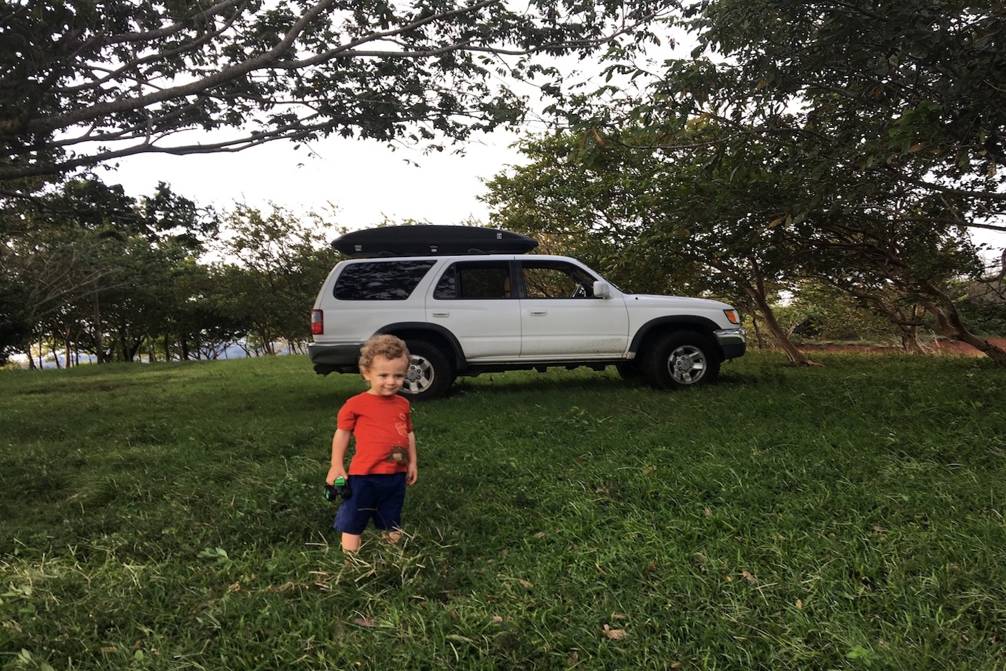 Aisling's son in front of "Coco," the family car that made the journey to Costa Rica.