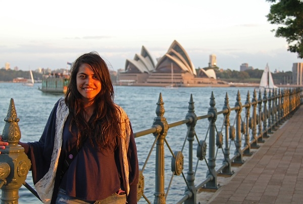 Roops stands in front of Sydney's iconic Opera House.