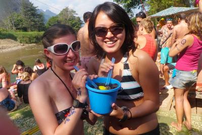 In Vang Vieng, Laos, tourists tube to visit the infamous river bars. 