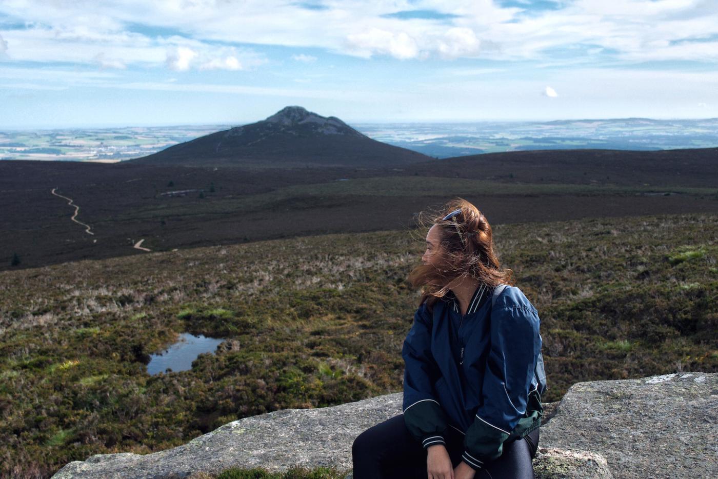 Mikee overlooking Bennachie Hills in Aberdeenshire, Scotland.