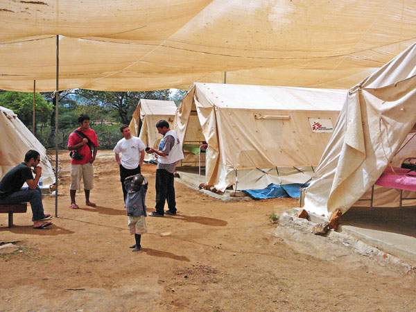 Zereik (centre) consults with colleagues at a MSF camp Amudat Kacheliba, Kenya. 