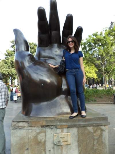 Nadine poses at Plaza Botero near Parque de Berrío.